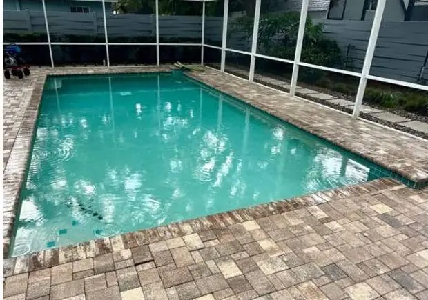 Before: screened pool with faded finish